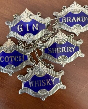 Five Silver And Enamel Spirit Tags